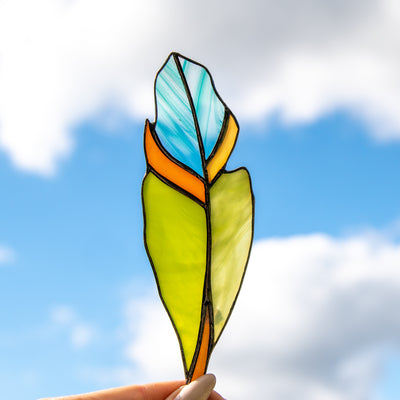 Stained glass green feather suncatcher with aquamarine blotchiness