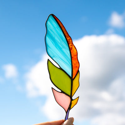 Bright colourful stained glass feather suncatcher