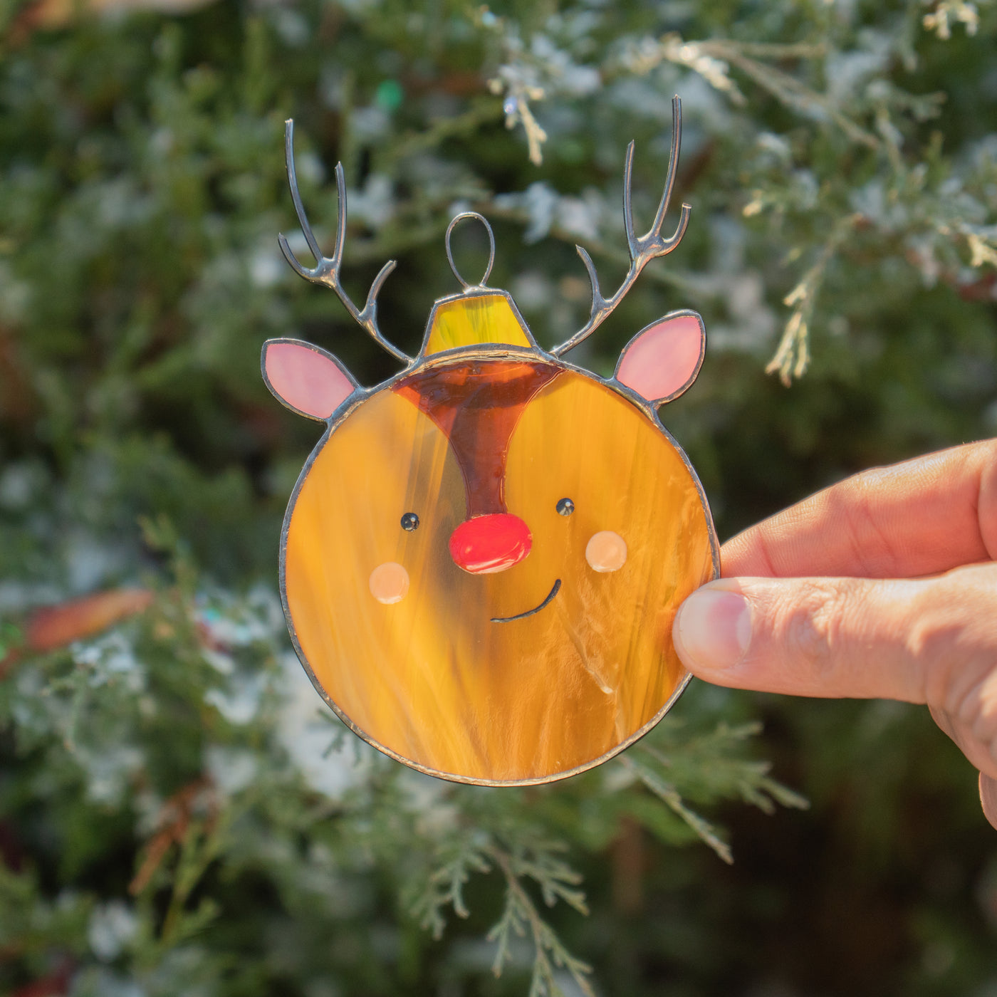 Stained glass suncatcher of reindeer with red nose 