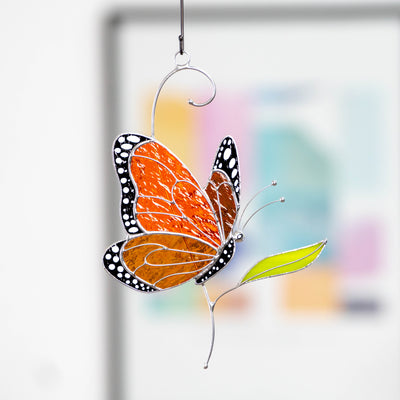 Orange Monarch butterfly window hanging handcrafted of stained glass