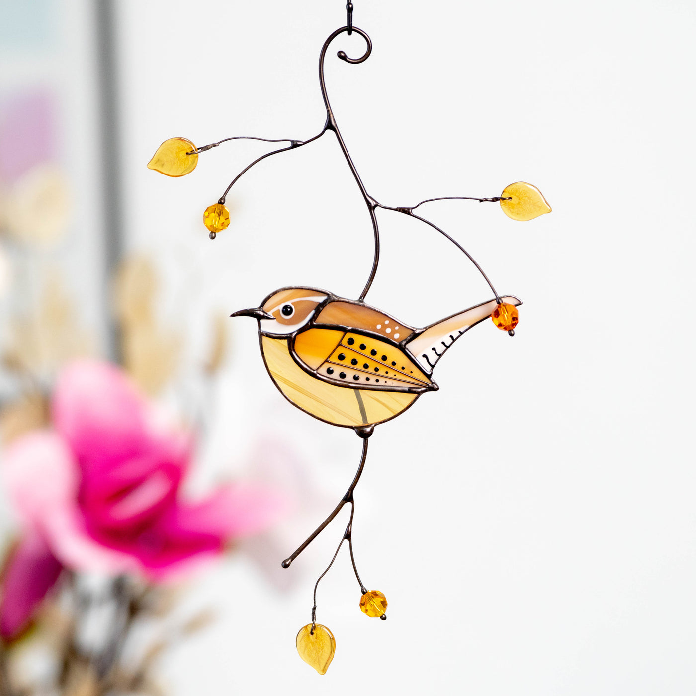 Stained glass suncatcher of Carolina wren on the branch with leaves and berries