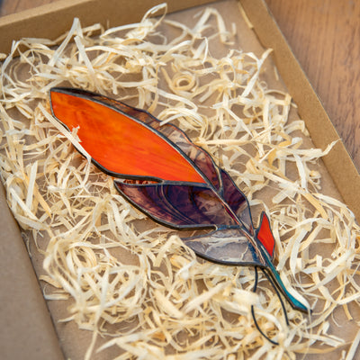 Orange feather with blotchiness suncatcher of stained glass