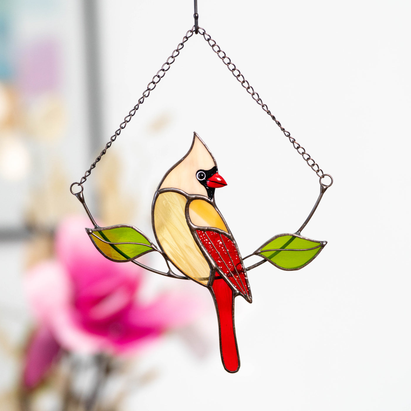 Sitting on the chain female cardinal window hanging of stained glass