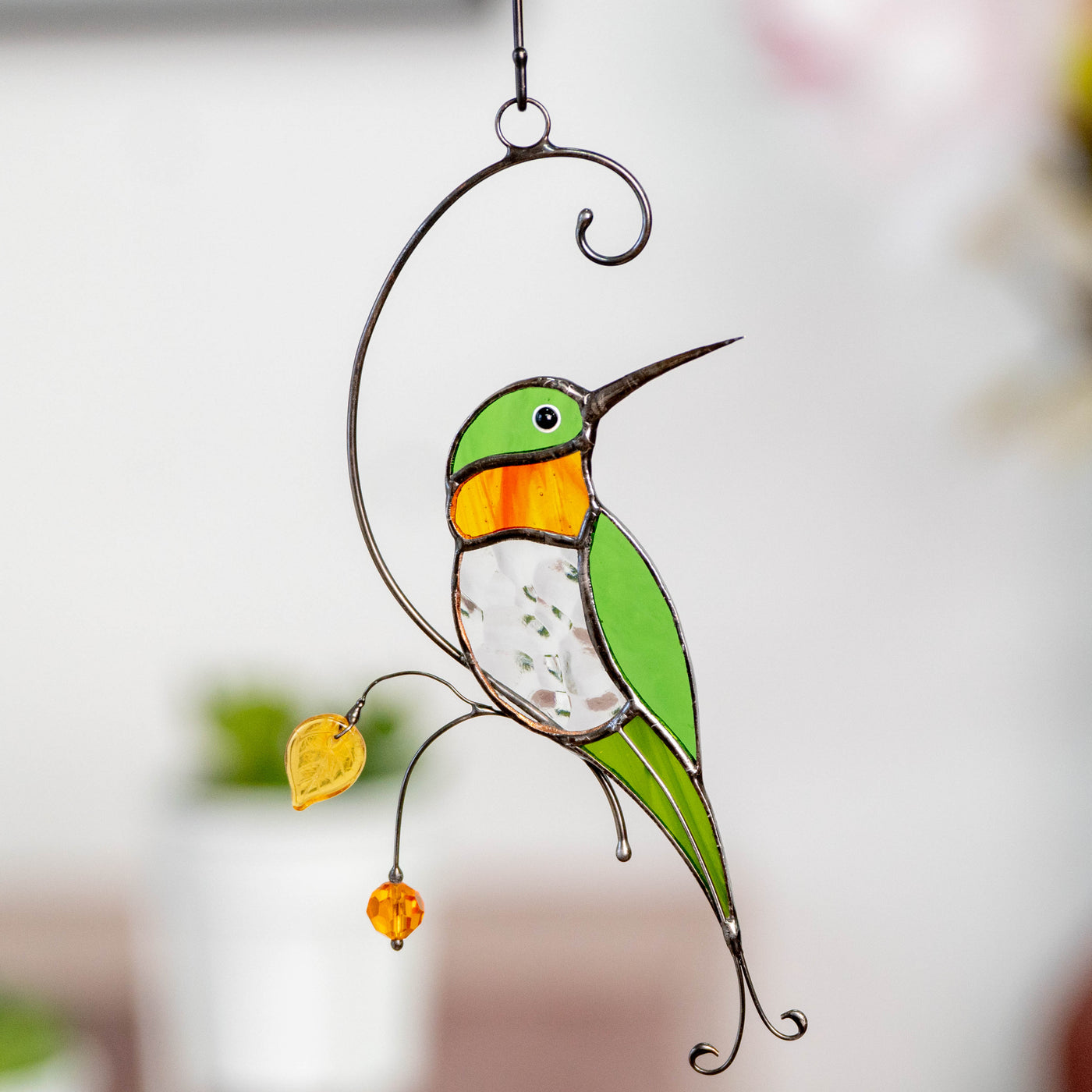 Stained glass hummingbird with transparent belly and orange throat window hanging