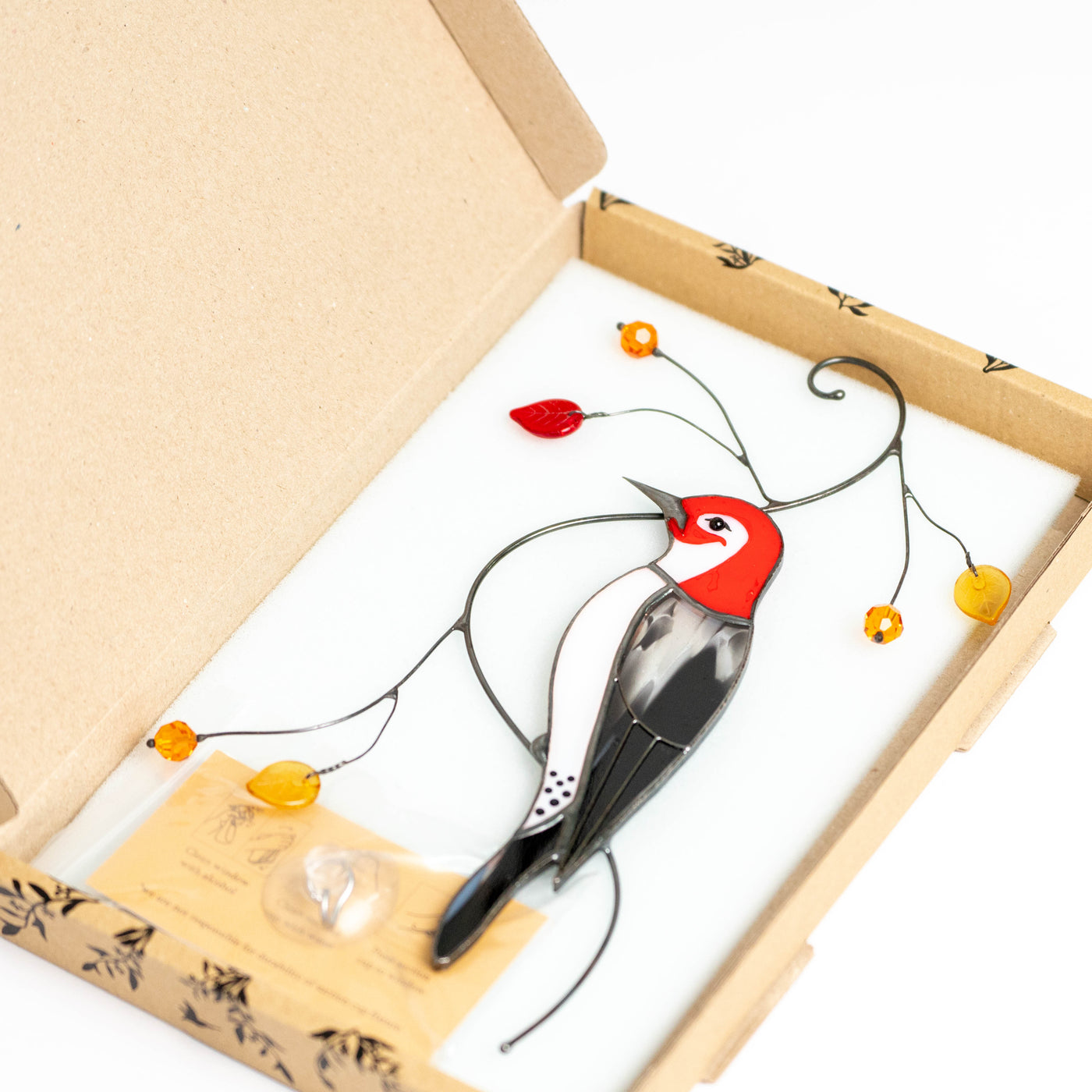 Woodpecker suncatcher in a brand box