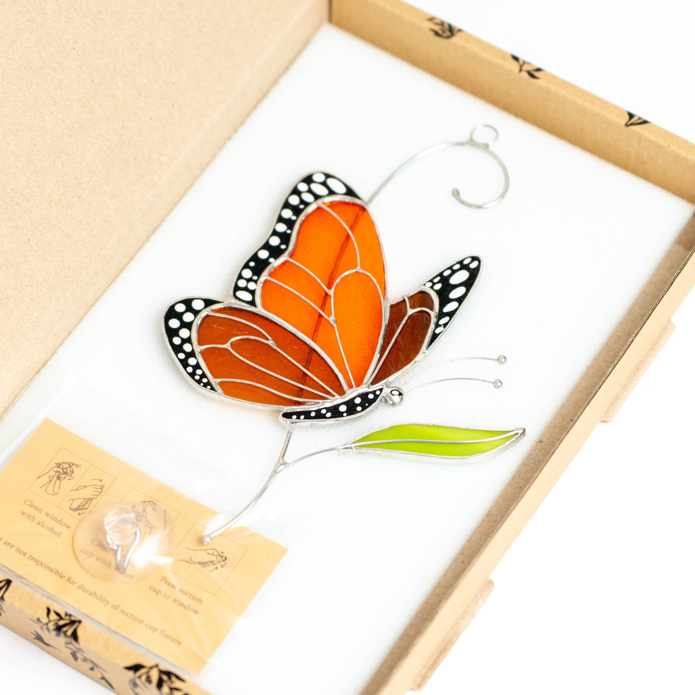 Stained glass monarch butterfly suncatcher in a brand box