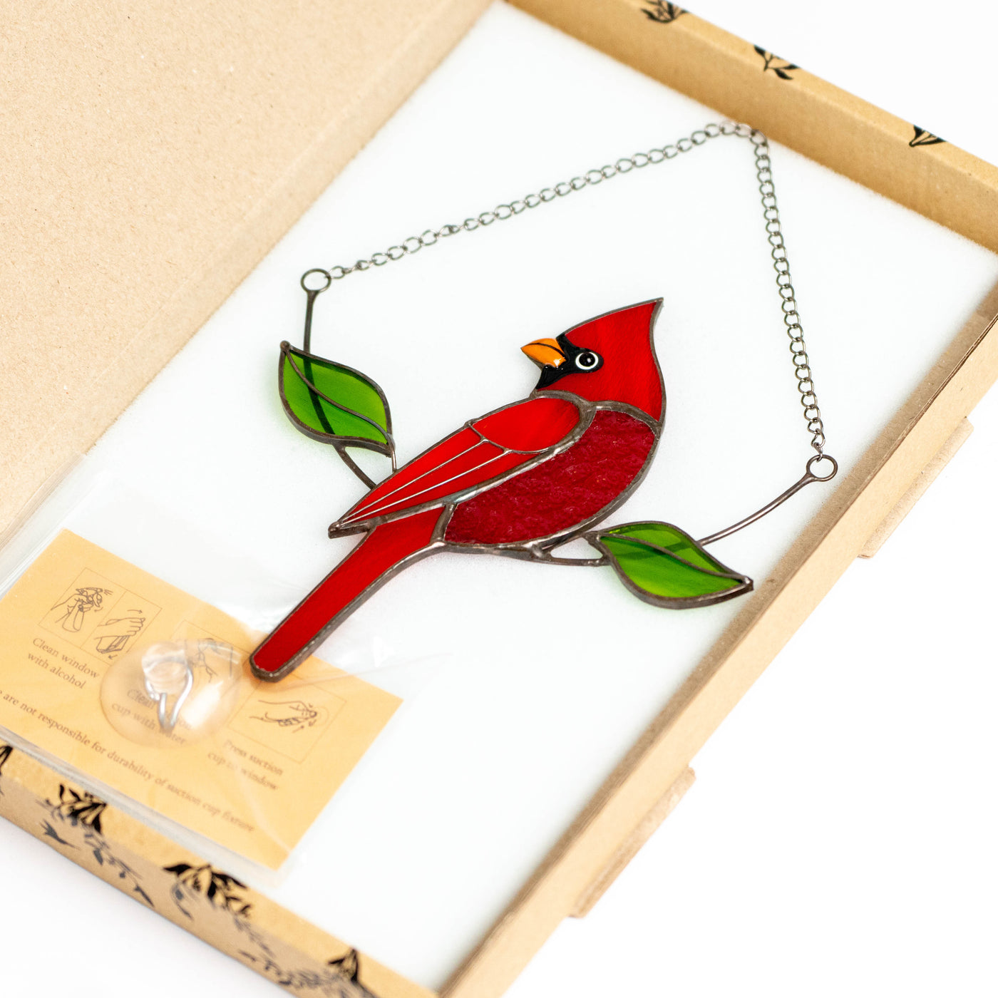Stained glass red bird suncatcher in a brand box