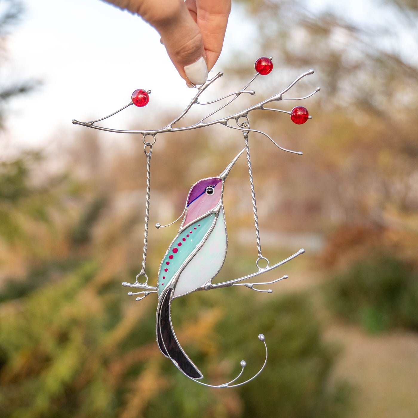 Purple stained glass hummingbird with white belly window hanging 