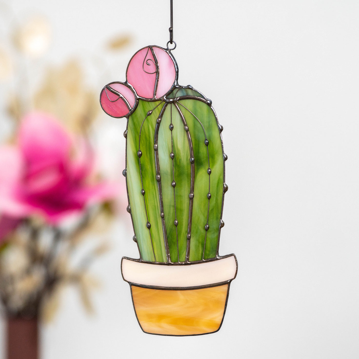 Stained glass window hanging of high cactus 