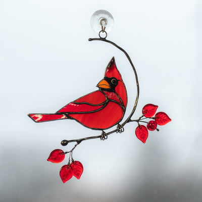 Stained glass suncatcher of a male cardinal on the branch