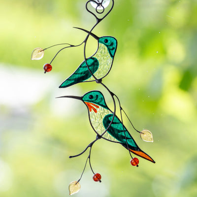 Stained glass green hummingbirds on the branch suncatcher