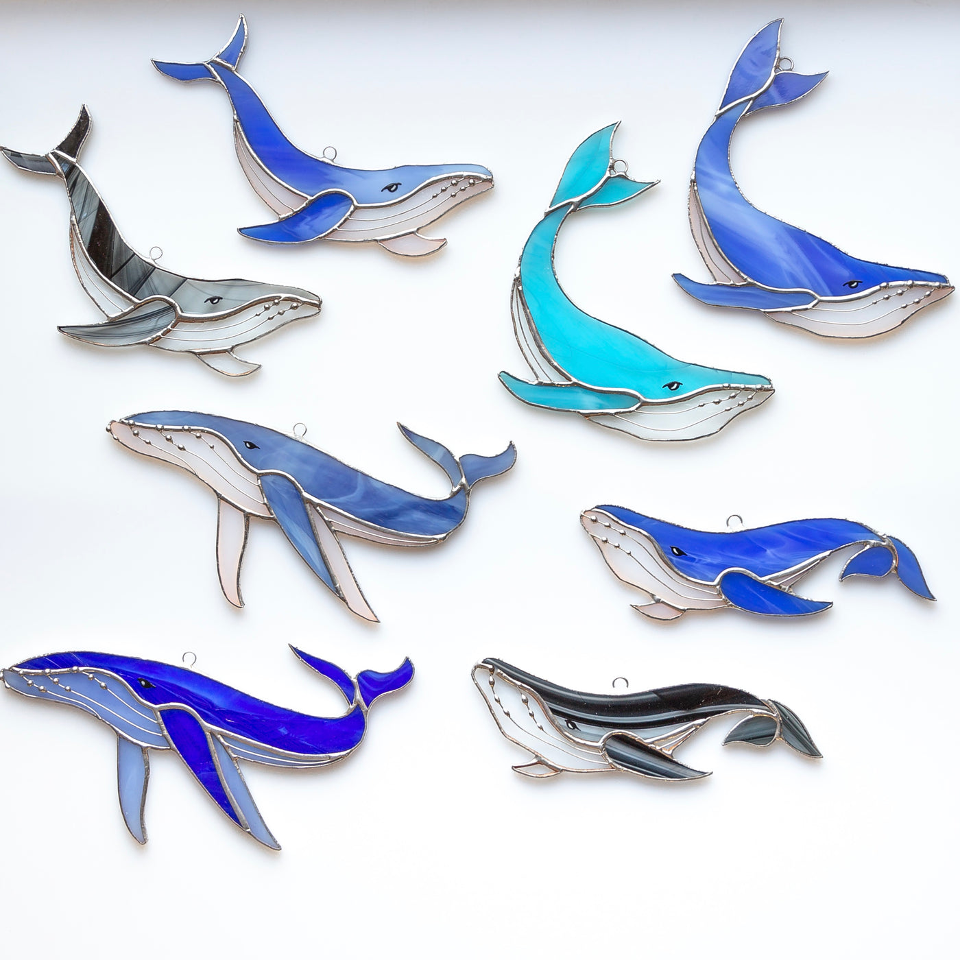 All possible variants of stained glass whales window hangings