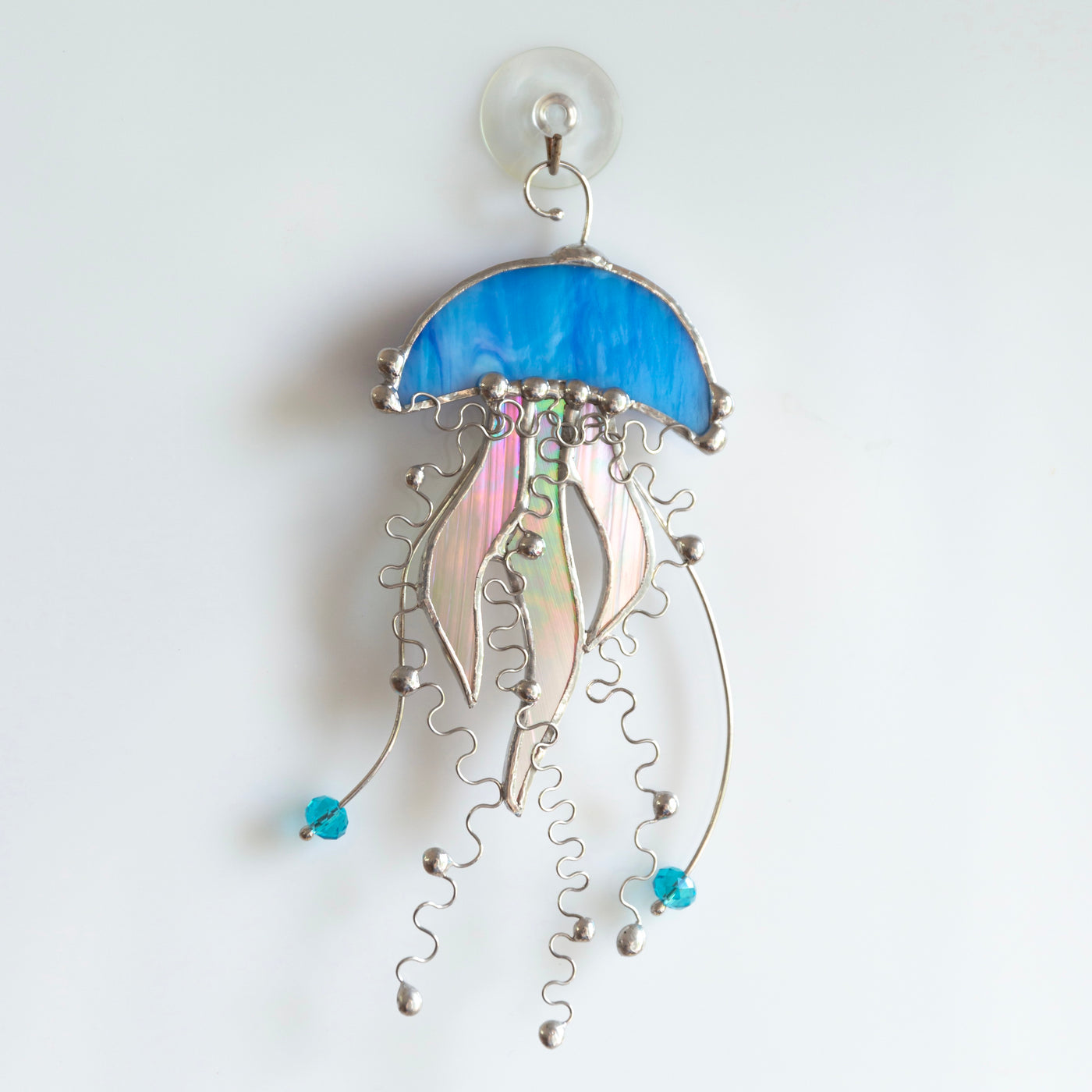 Blue stained glass jellyfish with iridescent tentacles suncatcher