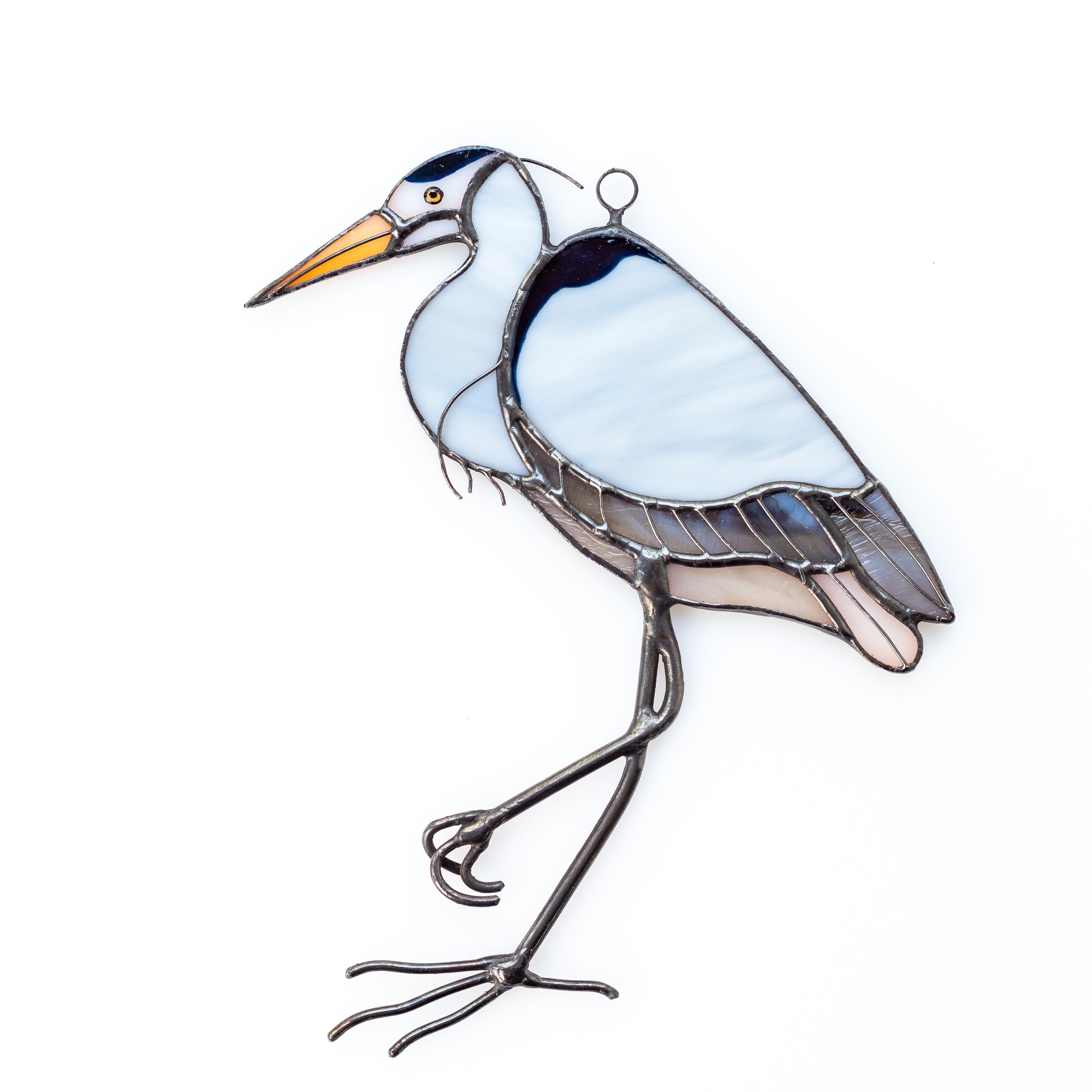 Stained glass blue heron standing on one leg suncatcher
