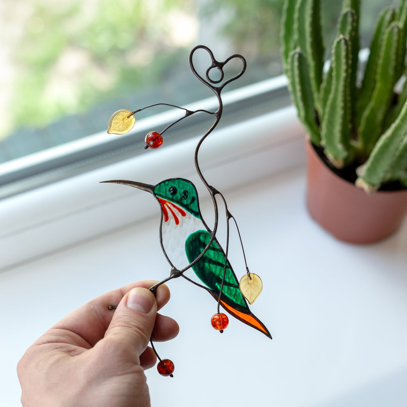 Green male hummingbird window hanging of stained glass