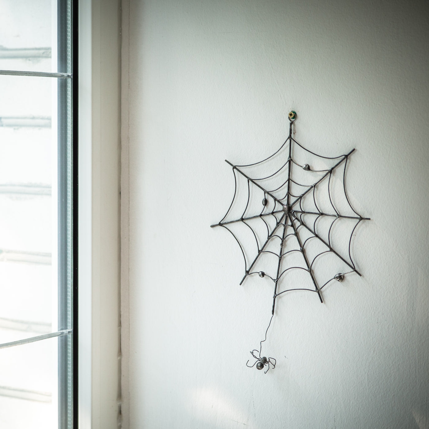 Creepy round spider web for Halloween decorations as a wall hanging