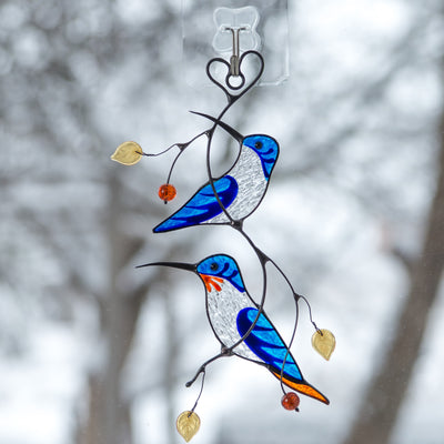 Stained glass blue hummingbirds on the branch window hanging