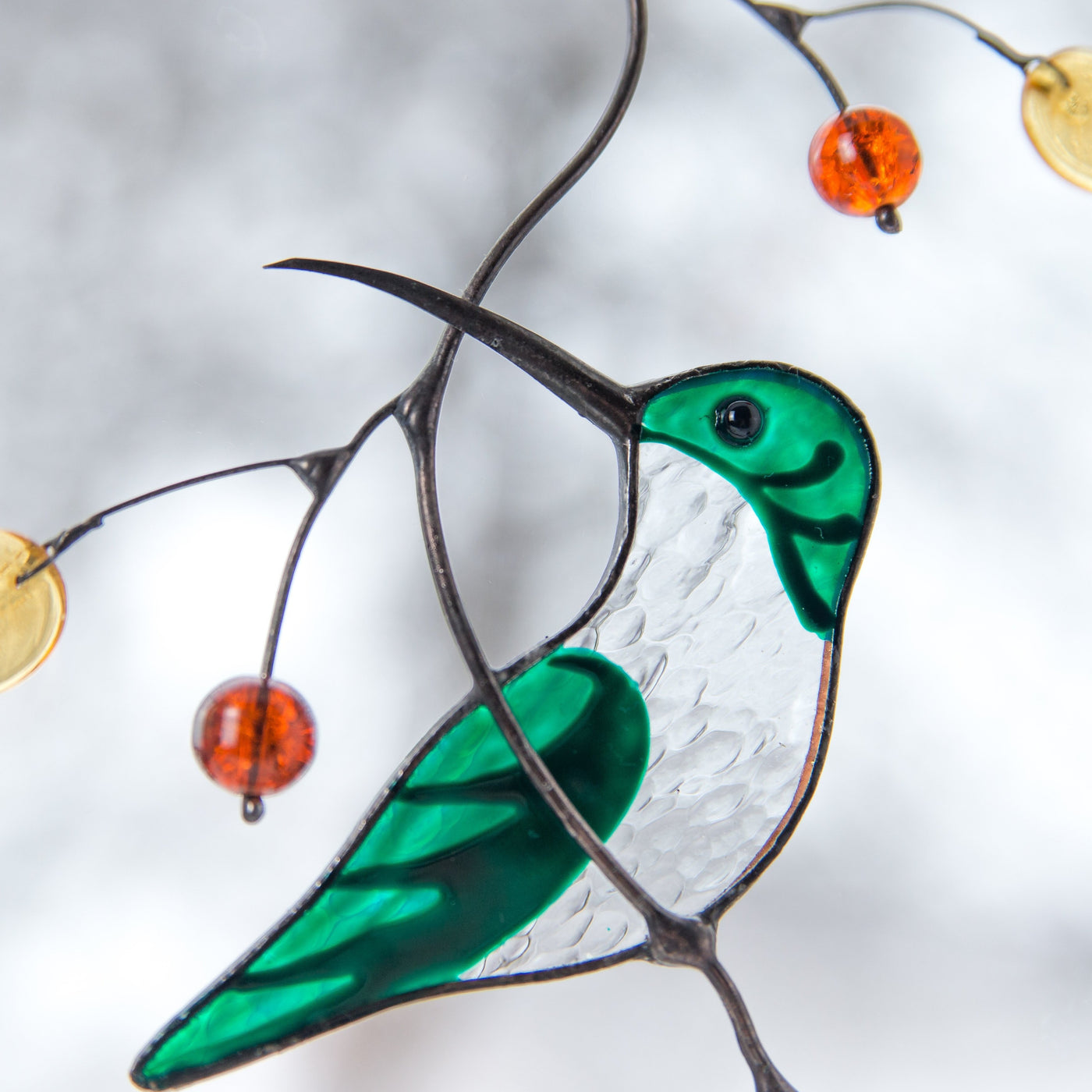 Zoomed stained glass female hummingbird 