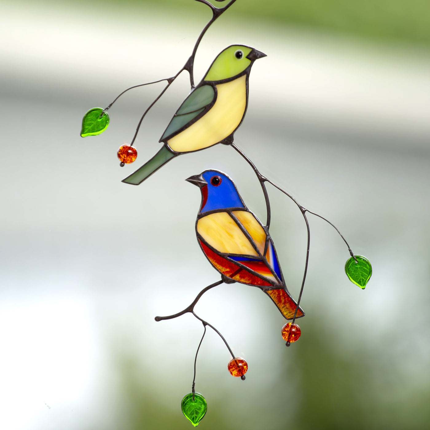 A pair of stained glass bunting birds sitting on the branch suncatcher
