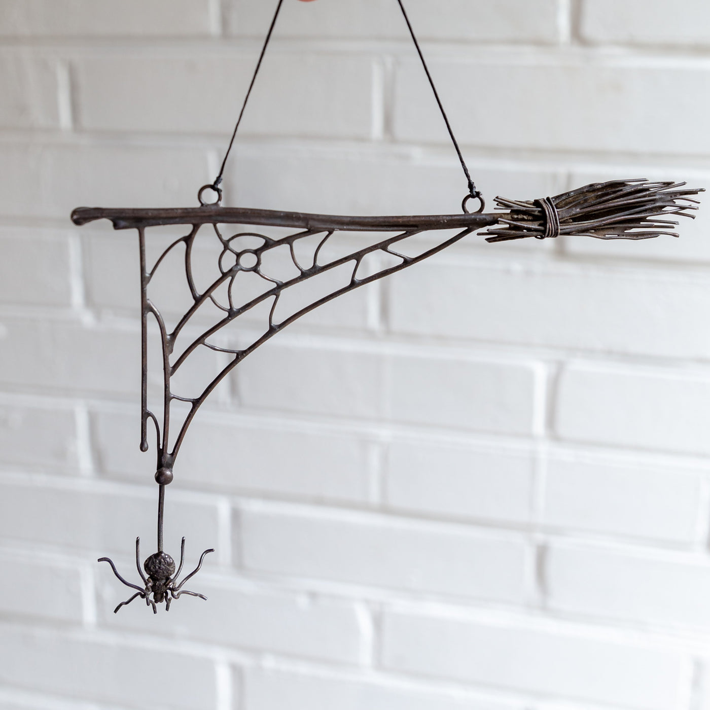 Copper wire Halloween broom with a web spider ghastly decoration