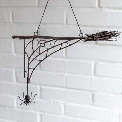 Halloween spider web with the broom and spider decoration for the wall