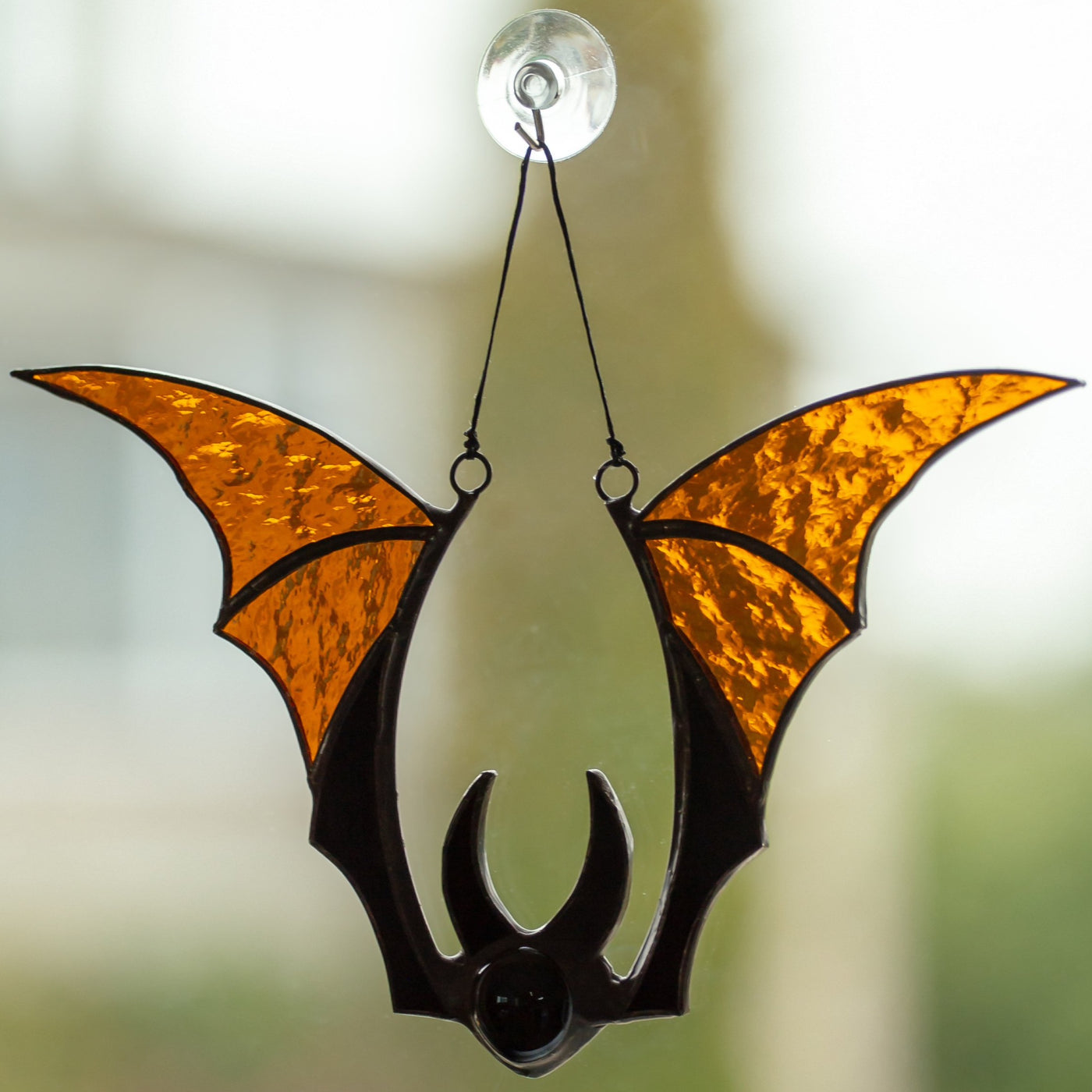 Brown-winged stained glass bat window hanging