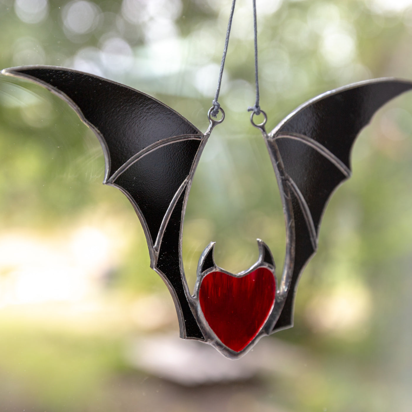 Stained glass vampire red heart with black wings for Halloween