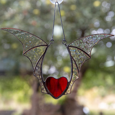Stained glass red heart with iridescent wings window hanging