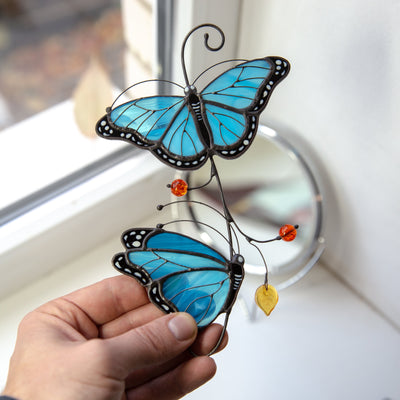 Stained glass blue morph butterflies one above another window hanging 