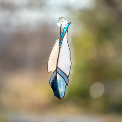 Blue stained glass feather window hanging