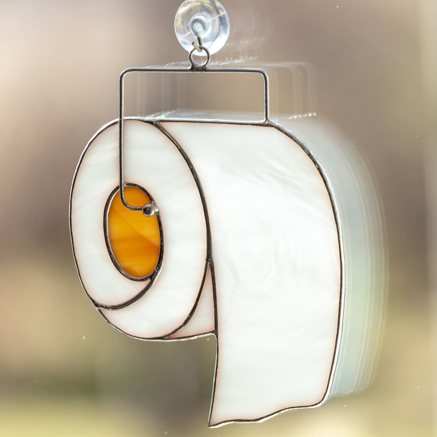Zoomed stained glass toilet paper suncatcher