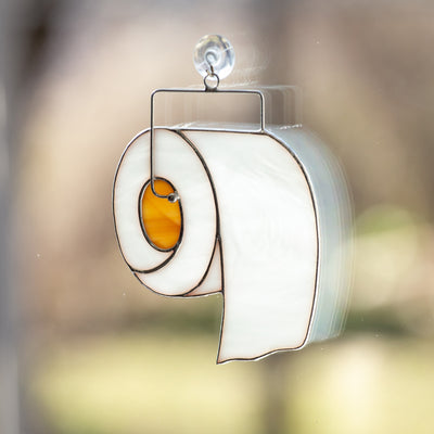 Window hanging of a stained glass toilet paper