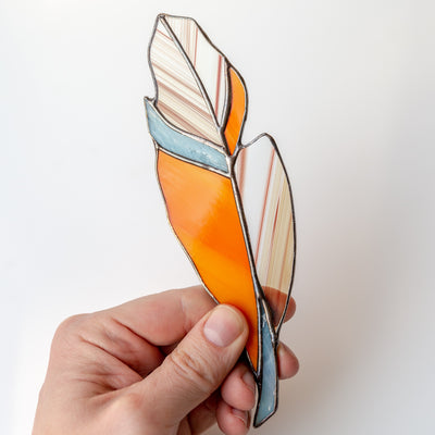 Stained glass orange feather with skyblue parts window hanging