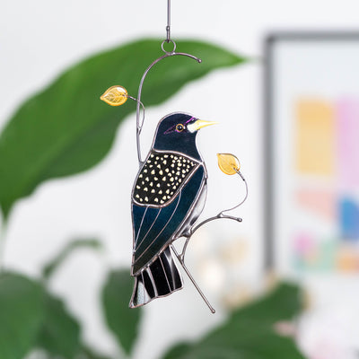 Decorative starling bird suncatcher in stained glass with golden glass leaves accents, perfect for home or gift.