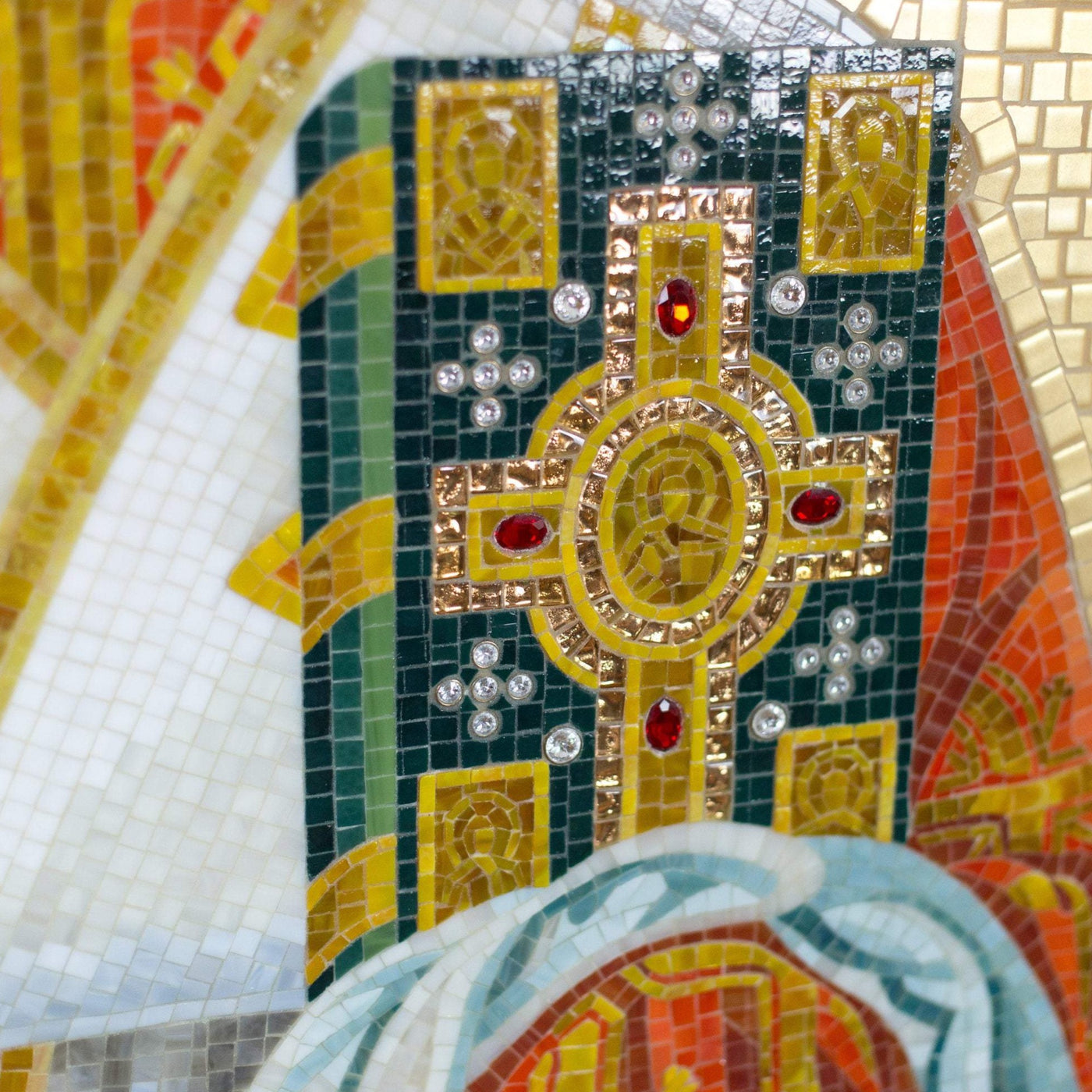 Zoomed stained glass green book with gems in hands of St. Nicolas