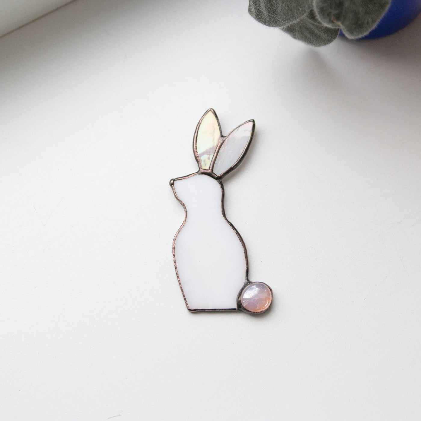 Stained glass white bunny with one pink ear suncatcher for window decor