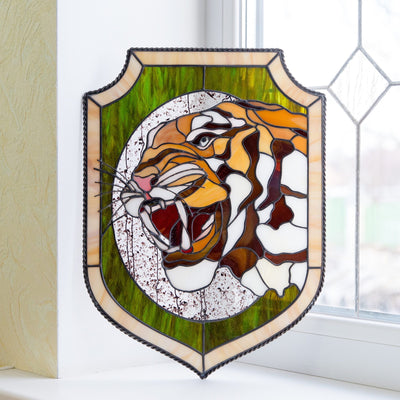 Stained glass panel depicting tiger and his fangs