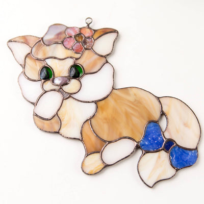 Window hanging of a stained glass kitty with the bow on her tail 