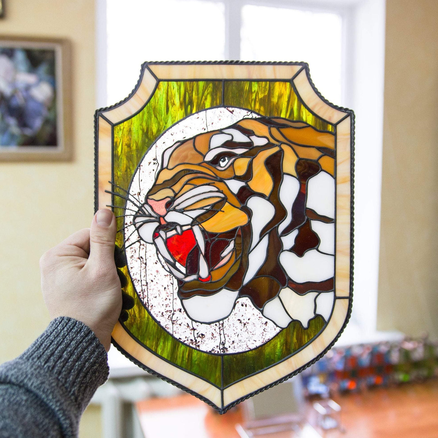 Stained glass tiger's fangs window hanging