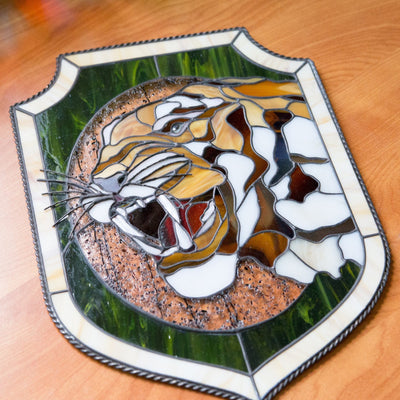 Portrait of tiger showing his fangs panel of stained glass
