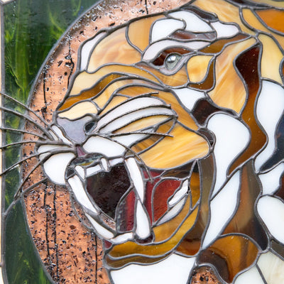 Zoomed stained glass panel of tiger portrait 