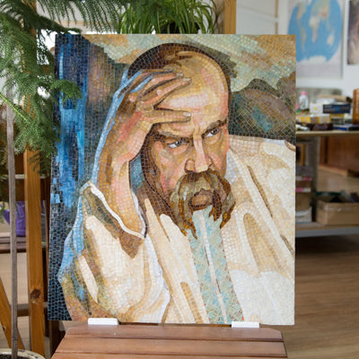 Stained glass mosaic portrait of Yaras Schevchenko touching his forehead with the hand 