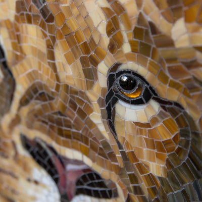 Zoomed eye of a strained glass lion mosaic 