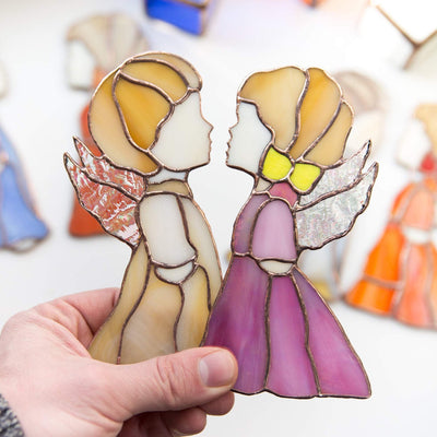 Beige boy angel and pink girl angel stained glass suncatchers