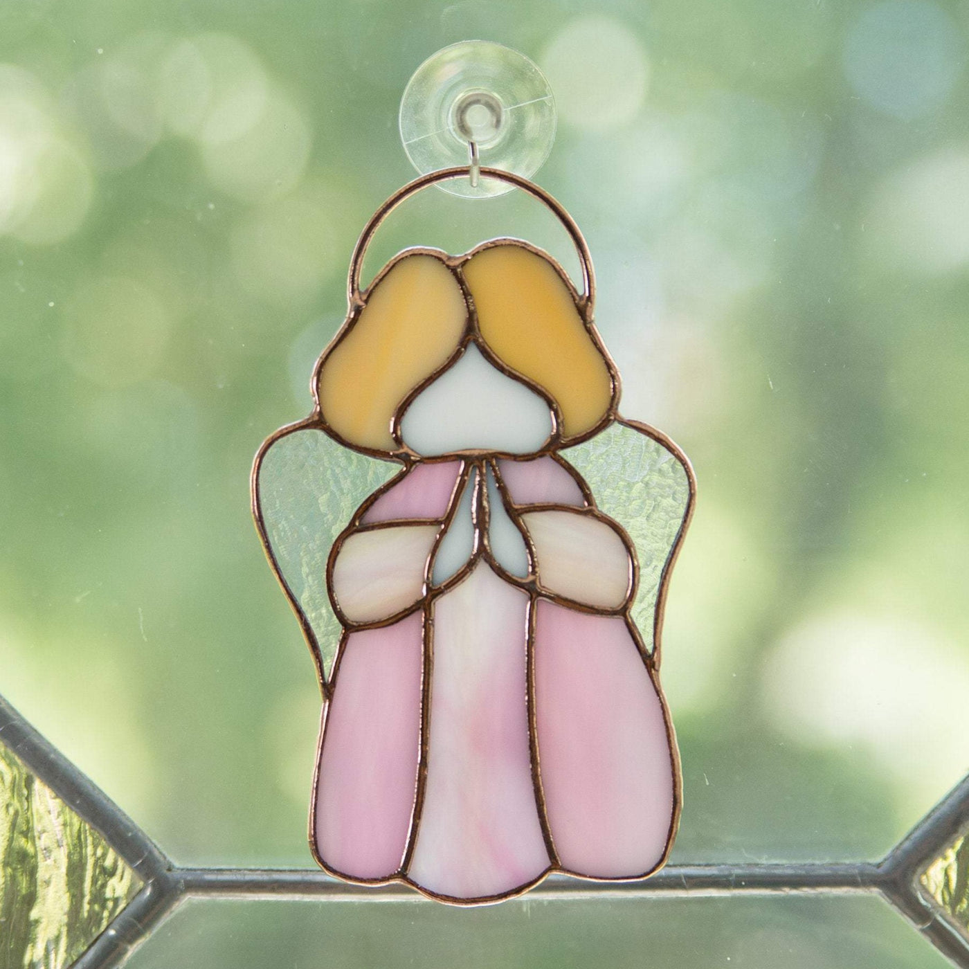 Pink stained glass angel window hanging