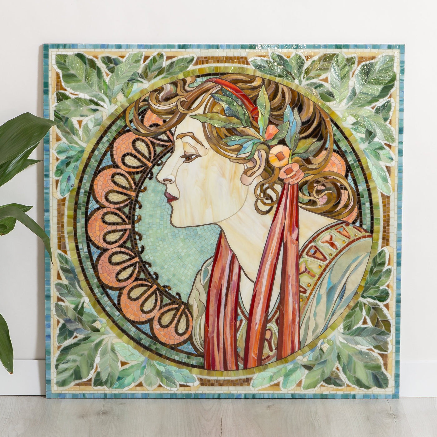 Stained glass mosaic depicting a woman in laurel leaves by Alphonse Mucha pattern
