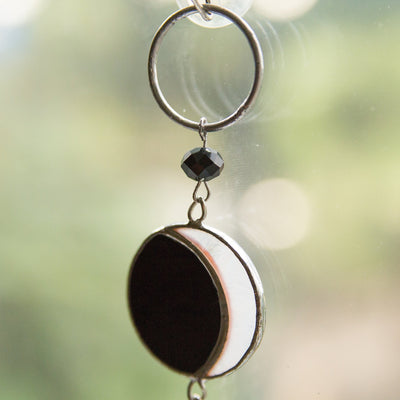 Zoomed stained glass moon phases suncatcher