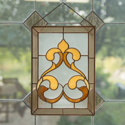 Stained glass panel with classic light brown ringlets for window decor