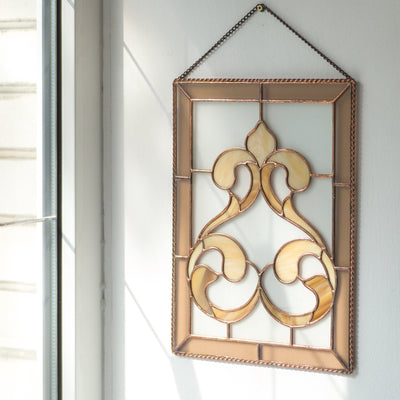 Classic stained glass panel with fanciful ringlets for window decor