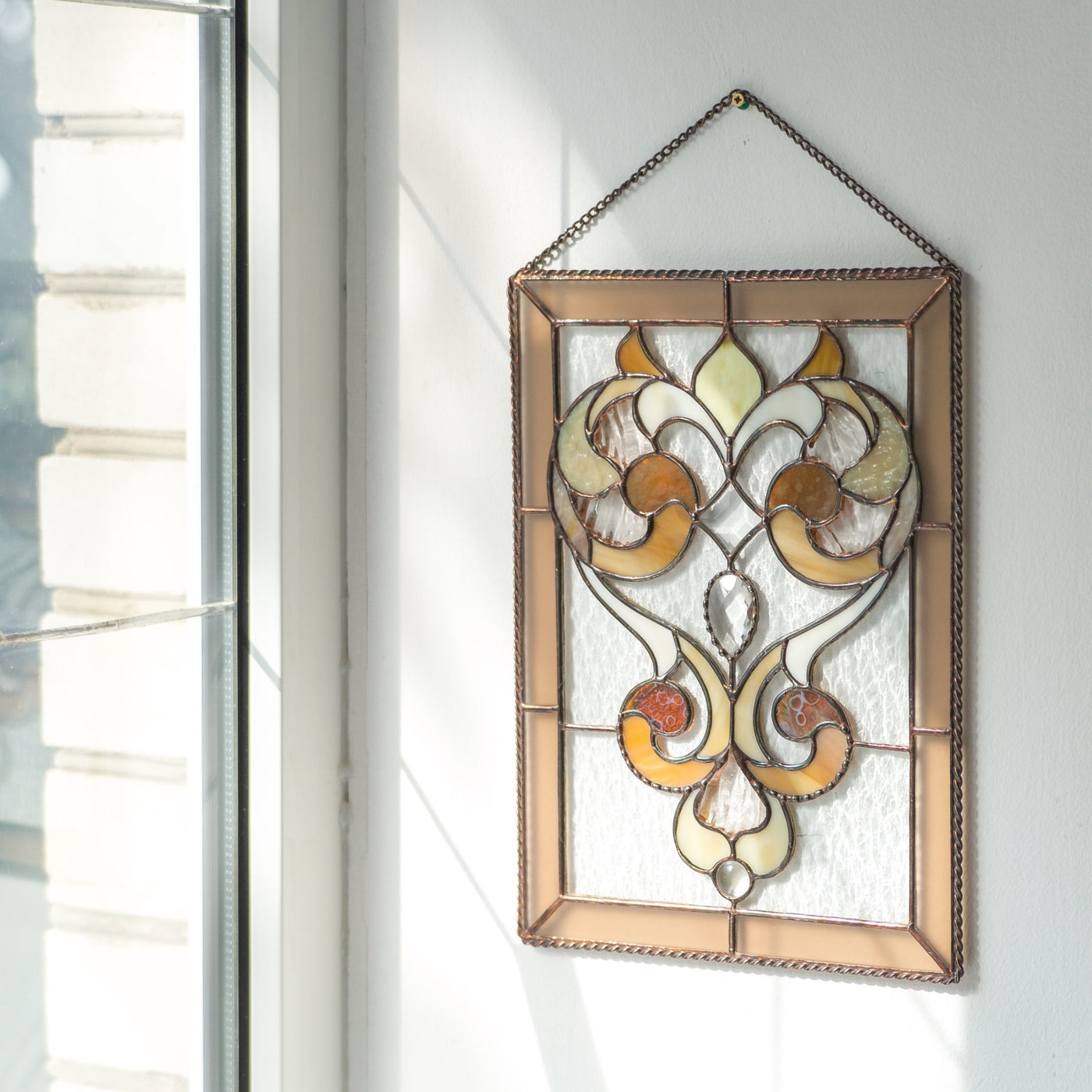 Clear panel with beveled inserts and beige ringlets of stained glass
